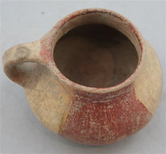 A Greek terracotta cup, c.2nd century BC, 8cm, repaired